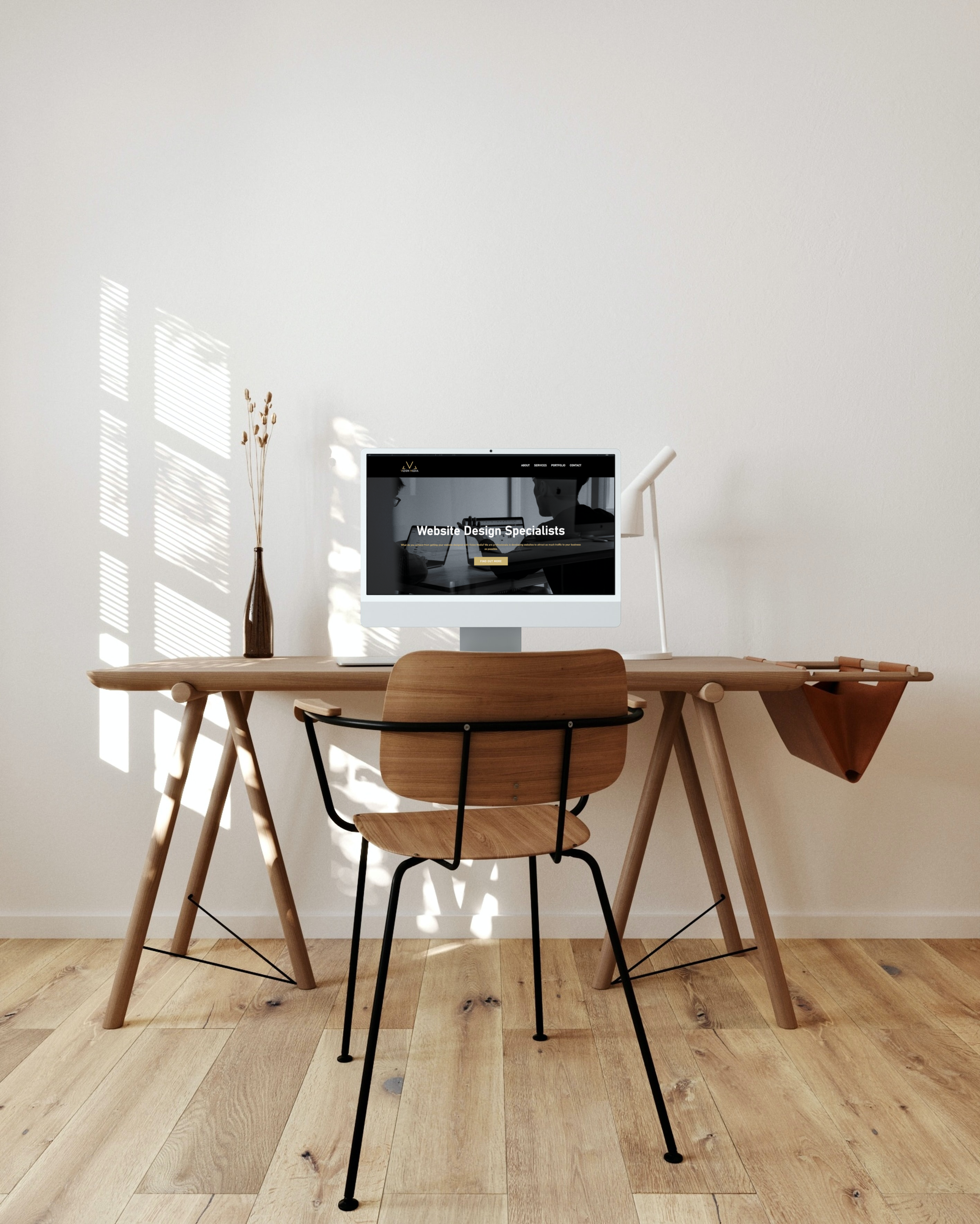 Silver iMac on the minimalistic wooden table near the wooden chair_screencapture-vizionmedia-co-uk-2023-01-04-14_57_05